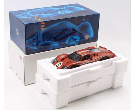 An Exoto Racing Legends 100 years of Ford 1/18th scale model of a Ford GT 40 MkIV, finished in copper, with racing number 3, 