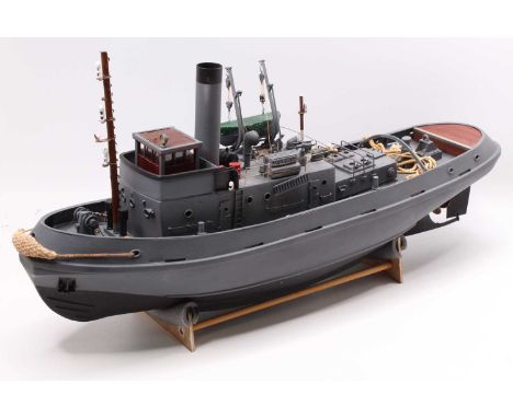 Gas Powered Kit Built and later adapted model of a Military Tug Boat, finished in grey and black with GRP Hull and Deck, the 