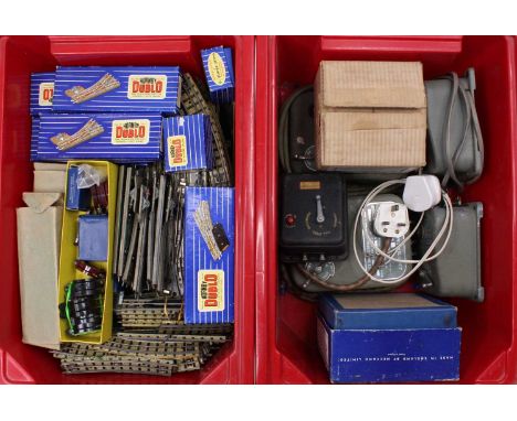 Two plastic crates containing Hornby-Dublo 3-rail track and controllers: Approx quantities:- 21 large radius curves; 34 stand