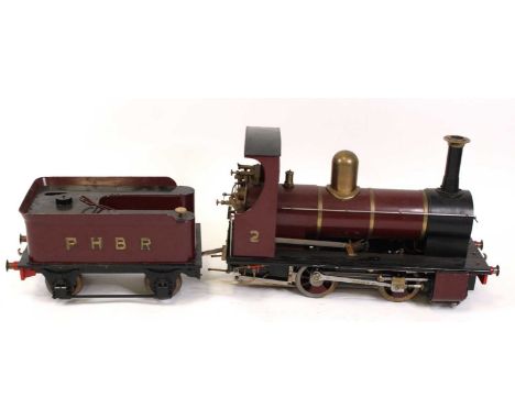 A well-engineered 5" gauge coal-fired "Polly 2" locomotive and tender, 0-4-0 alignment and hand painted in maroon with 4 whee
