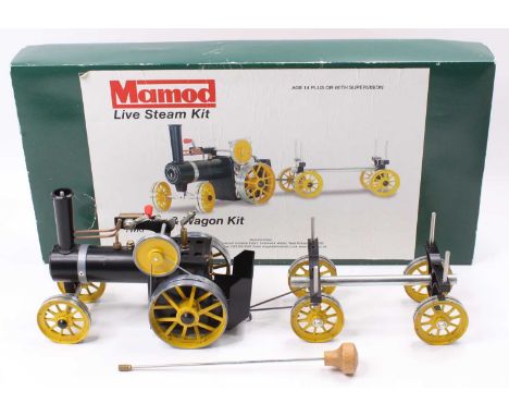 A Mamod live steam TWKI tractor and wagon kit, built example, housed in the original box with rubber bands and tyre replaceme