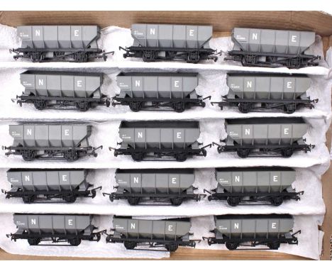 Fifteen 20 tons NE 4-wheeled hopper wagons, grey with black chassis. Some weathering. Very well made kit built items.