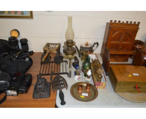 A quantity of various metalware to include a silver plated teapot, oil lamp, trivet stands, flat irons etc.