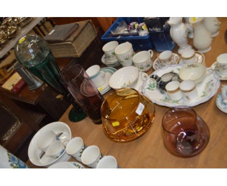 A quantity of various coloured glassware to include an amethyst coloured vase