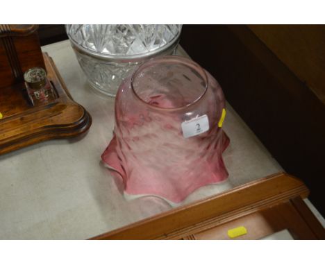 A cranberry glass oil lamp shade 