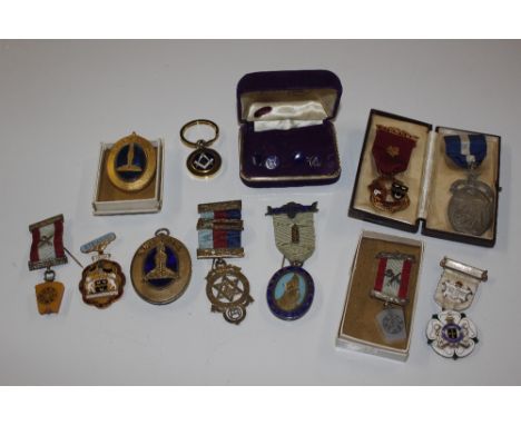 A box of masonic regalia to include silver and other medals; a pair of silver an enamel decorated cuff-links etc.