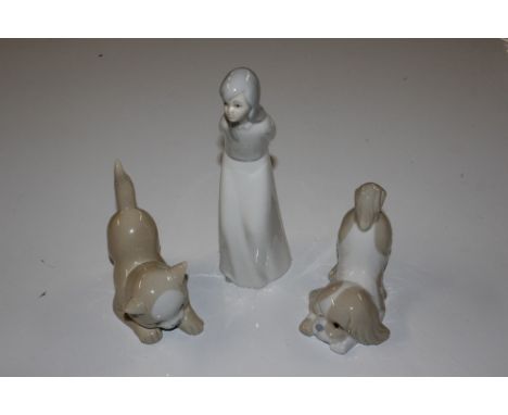 A Lladro style figurine and Spanish porcelain model of a puppy, and another of a kitten 