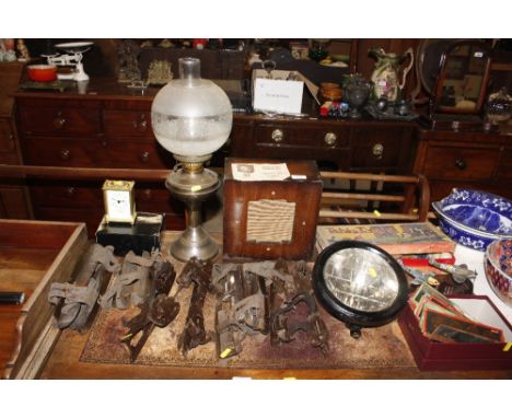 A large quantity of various collector's items to include a vintage headlamp, ice skating blades, radio speaker, table tennis 