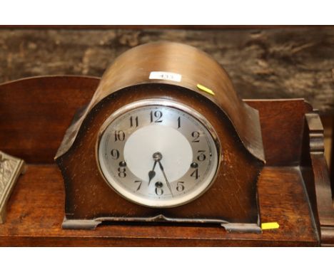 An oak cased chiming mantel clock 