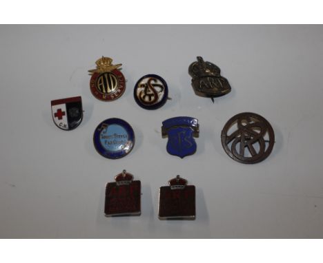 A silver ARP badge; various other enamel and other badges 
