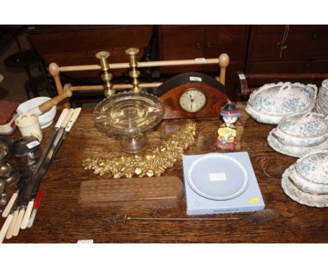 A pair of brass candlesticks; an Edwardian inlaid mantel clock; a copper mounted cribbage board etc.