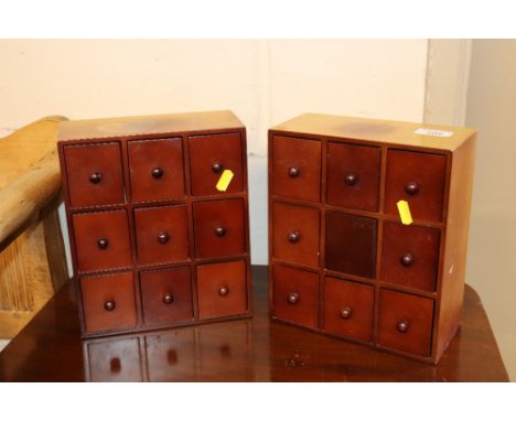 A pair of multi drawer trinket chests 