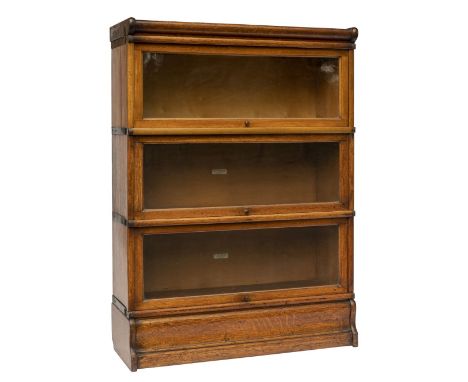 Bookcase. A 1920s oak Globe Wernicke bookcase, comprising 3 tiers, each with hinged glass door with manufacturer's plaque, 12