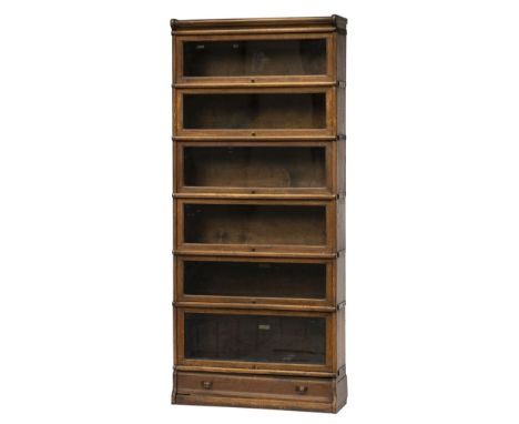 1920s Globe Wernicke Bookcase. A 1920s oak Globe Wernicke bookcase, comprising 6 tiers each with hinged glass door and manufa