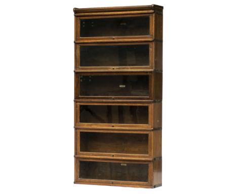 Bookcase. A 1920s oak Globe Wernicke bookcase, comprising 6 tiers each with hinged glass door with manufacturers plaque, 177c