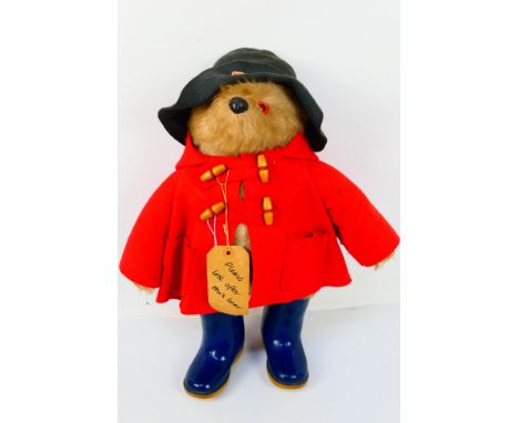 Paddington Bear. An original Paddington bear with blue felt hat, red coat, label and original blue Dunlop boots. No scent or 