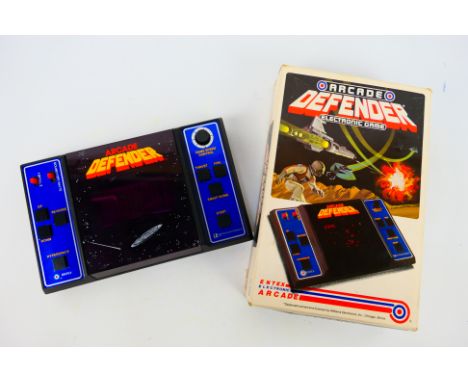 Entex - Arcade Defender - Williams. A boxed #6088 Arcade Defender, Electronic Game. Entex Electronic Arcade by Williams. Test