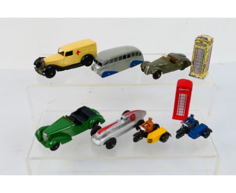 Dinky Toys - A group of unboxed Dinky Toys and Dinky Toy accessories. Lot includes Dinky Toys 23b Hotchkiss Racer; 29b Stream