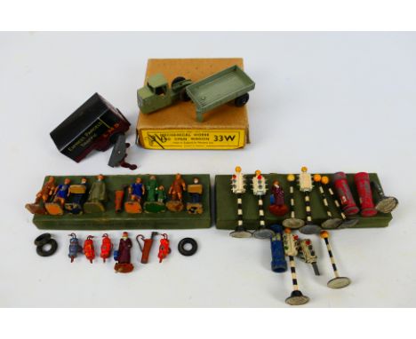 Dinky Toys - A Dinky Toys Mechanical Horse with a group of Dinky Toys accessories. The grey Mechanical Horse appears to be in