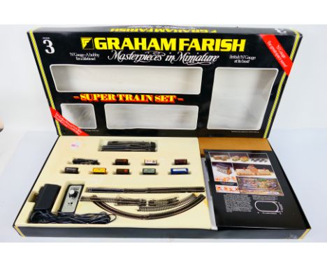Graham Farish - A boxed N gauge Super Train Set with a 2-6-4 tank engine, 8 x wagons, track and line side accessories. The it