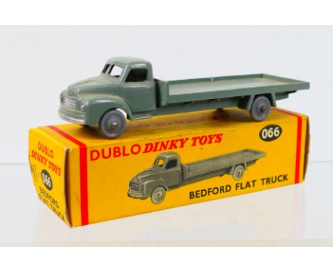 Dinky Dublo - A boxed Dinky Dublo #060 Bedford Flat Truck. The model in grey appears to be in Excellent Plus slightly dusty c