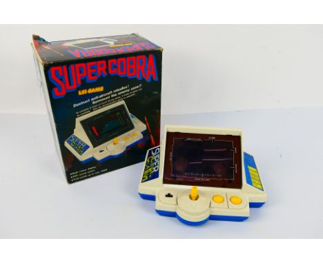 Konami - Gakken - Super Cobra. A boxed #7123 Super Cobra, LSI Game. Tested with Four Type C batteries, screen, sound and butt