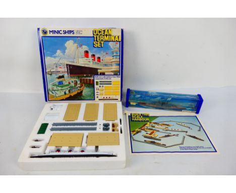 Tri-ang - Minic Ships -  A boxed Ocean Terminal Set in 1:1200 scale # M902 and a boxed HMS Vanguard # M741. The models appear