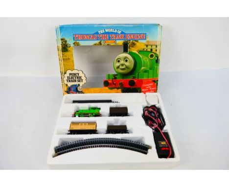 Hornby - A boxed World Of Thomas The Tank Engine Percy electric train set # R182. It shows some signs of age and use and appe