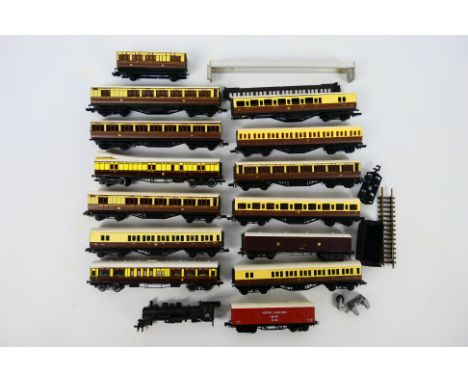 N Gauge - A rake of unboxed, N gauge rolling stock predominately coaches, with an unmarked N gauge locomotive body and parts 
