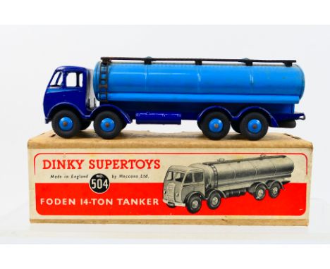 Dinky Toys - A boxed Dinky Toys #504 Foden 14 Ton Tanker. The model with 1st type cab with dark blue cab /chassis, silver fla