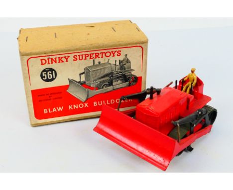 Dinky Toys - A boxed Dinky Toys #5561 Blaw Knox Bulldozer. The model with red body, green rubber tracks, and tan driver appea