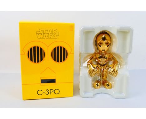 Star Wars - Medicom Toys. A boxed, unopened C-3PO figure by Medicom / Sideshow. Item appears min in Mint box. (This does not 