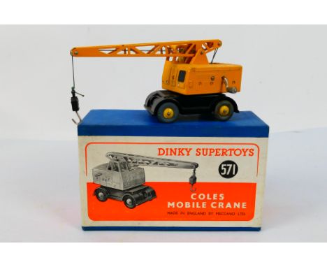 Dinky Toys - A boxed Dinky Toys #571 Coles Mobile Crane. The model in yellow and black with tan driver appears to be in Excel