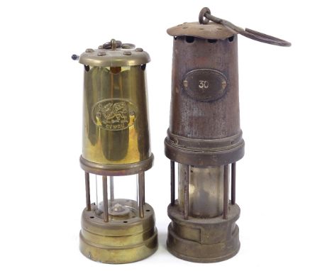 A brass-mounted Vintage miner's lamp, by Patterson Lamps Ltd Gateshead-on-Tyne, together with another brass miner's lamp (2) 