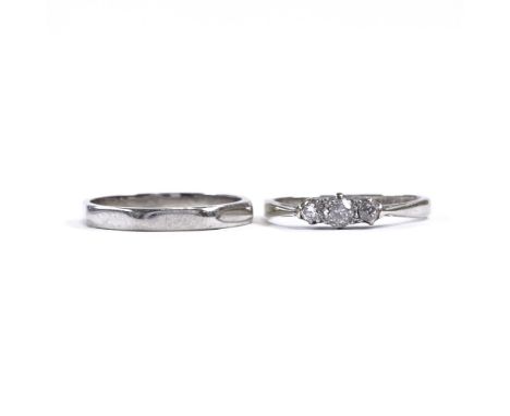 An 18ct white gold 3-stone diamond ring, total diamond content approx 0.2ct, and an 18ct white gold octagonal wedding band ri