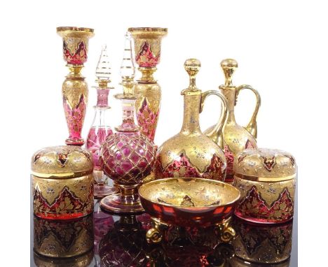 A collection of mainly 19th century gilded Bohemian ruby glassware, including a pair of candlesticks, height 17cm, a pair of 