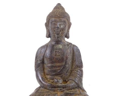 A Chinese patinated bronze seated Buddha, height 18cm 