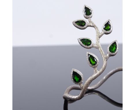 A modern handmade sterling silver Russian diopside naturalistic design torque bangle, textured ivy design settings with pear-