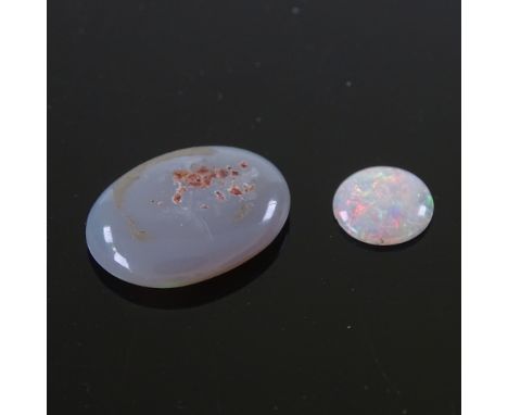 2 loose opals, including oval cabochon black opal, 14.1mm x 10.9mm x 3.2mm, and a round cabochon white opal, 6.8mm x 1.6mm, 0