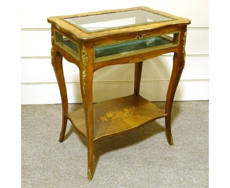 A late 19th century French kingwood and marquetry inlaid display table, with gilt-bronze mouldings and mounts, and bevel glas