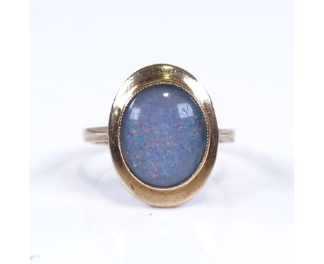 A 9ct gold opal doublet dress ring, setting height 16.8mm, size N, 3.1gGood overall condition, no damage or repairs, stone ha