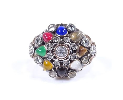 A Continental 14ct gold gem set bombe dress ring, set with synthetic stones including tiger's eye, sapphire, ruby, paste, etc