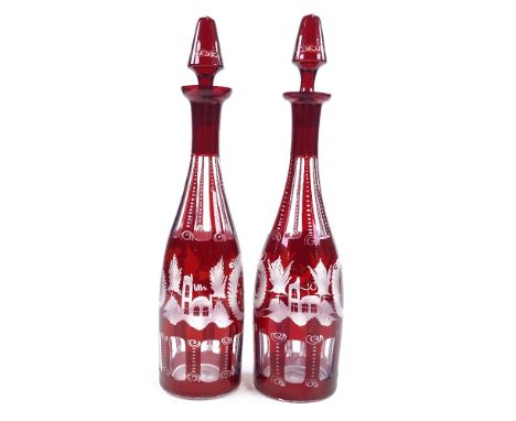 A pair of 19th century Bohemian ruby overlay glass decanters, with wheel-cut panel decoration, height 38cmPerfect condition 