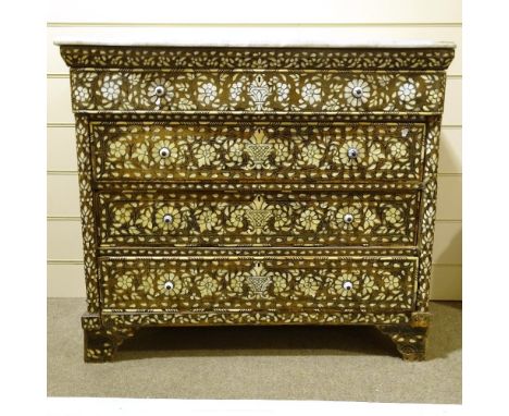 A 19th century Lebanese stained wood chest of 4 long drawers, with allover inlaid mother of pearl and ivory floral marquetry 