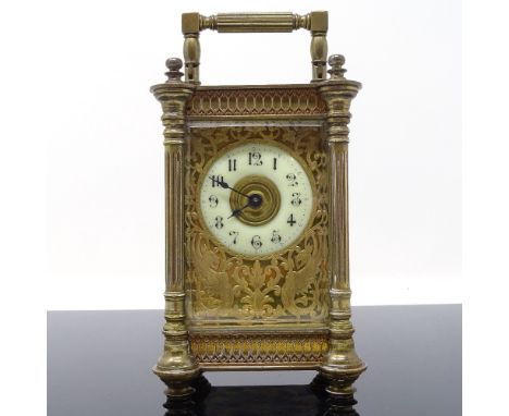 A 19th century French gilt-brass cased carriage clock, enamel dial in pierced and engraved griffon design surround, with blin