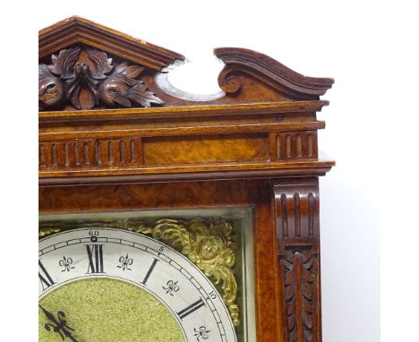 A 19th century carved walnut-cased mantel clock, architectural broken pediment with carved floral mount, brass dial with silv