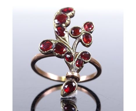 An unmarked gold flat top garnet floral spray dress ring, setting height 24.8mm, size K, 2.8gGood overall condition, ring has