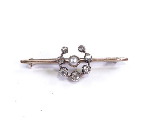 An early 20th century 9ct rose gold pearl and diamond horseshoe bar brooch, total diamond content approx 0.28ct, brooch lengt