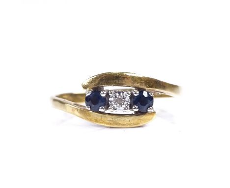 An 18ct gold 3 stone sapphire and diamond crossover ring, setting height 7.6mm, size Q, 2.9gGood overall condition, all stone