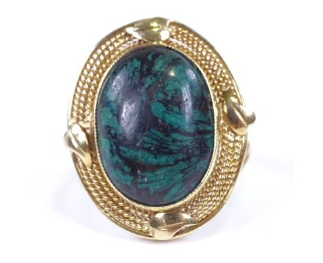 A Middle Eastern 14ct gold cabochon hardstone dress ring, rope twist surround with wirework shank, setting height 27.4mm, siz